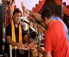 Video: currency notes showered on singer kirtidan gadhvi in a marriage 