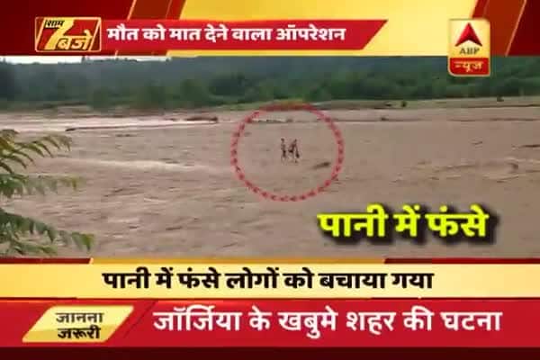 Georgia: Watch how two men stuck in flood water were rescued with ...