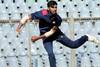 Vidarbha spinner Akshay Karnewar bowls with both hands