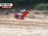 Uttarakhand: Video shows how people risk lives and travel on flooded roads