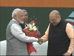 PM Modi, Amit Shah welcomed ahead of manifesto release