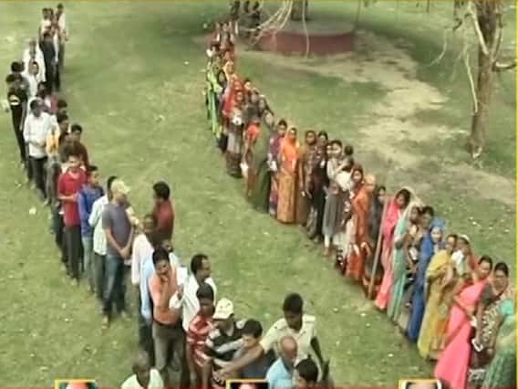 People stand in long queues to vote in Bihar's Araria