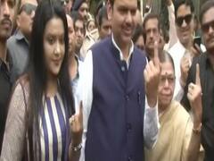 Devendra Fadnavis casts vote along with family