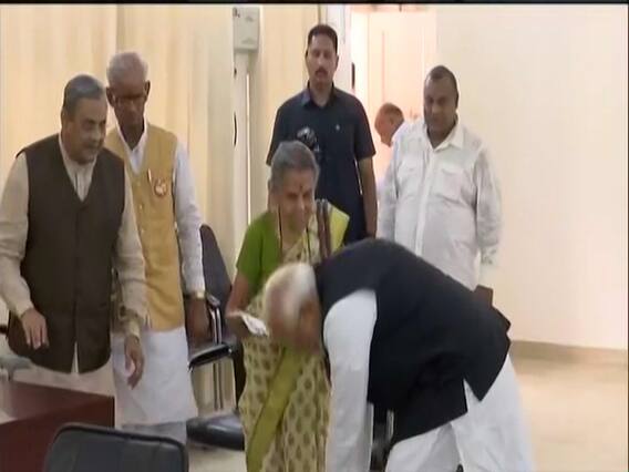 PM Modi touches Annapurna Shukla's feet, files nomination from Varanasi