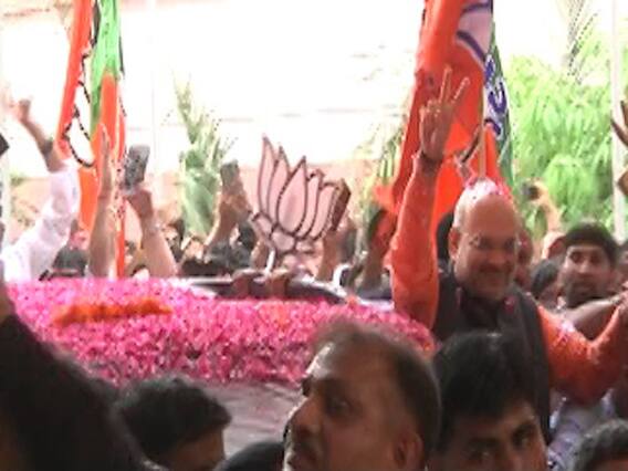Excited workers take selfie with Amit Shah at party headquarters
