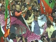 BJP President Amit Shah welcomed by party workers at Delhi office