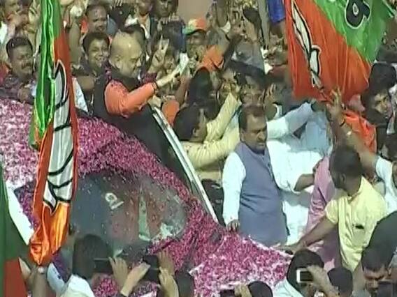BJP President Amit Shah welcomed by party workers at Delhi office