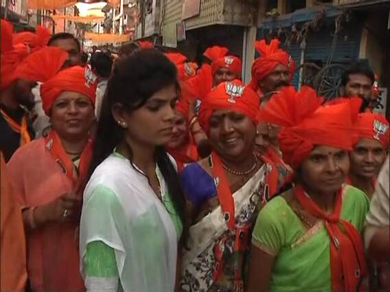 Women wear orange turbans in Sadhvi Pragya's roadshow