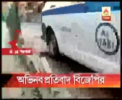 মধ্যমগ্রামে রাস্তার জমা জলে মাছ ছেড়ে ধানগাছ পুঁতে অভিনব প্রতিবাদ বিজেপির