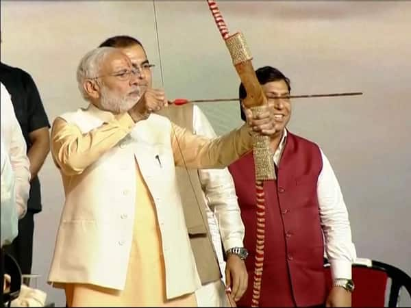 PM Narendra Modi shoots from bow at Dussehra celebrations in Dwarka